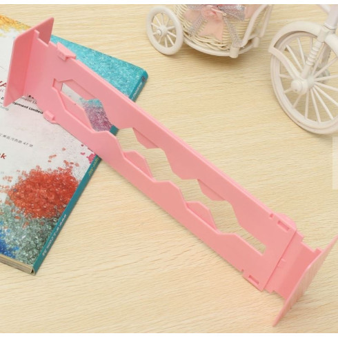 Nastaviteľná prepážka do zásuvky