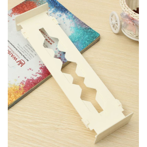 Nastaviteľná prepážka do zásuvky