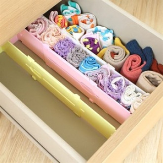 Nastaviteľná prepážka do zásuvky